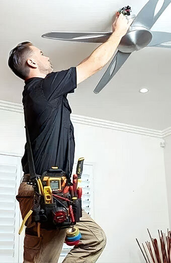 Electrician Repairing Ceiling Fan